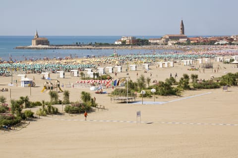 Private beach, white sand, sun loungers, beach umbrellas