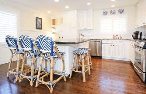 Kitchen island seats 5 comfortably. Gas stove. New microwave and dishwasher.