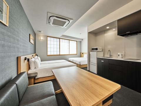 Apartment (4 Single-Beds) | Down comforters, in-room safe, desk, free WiFi