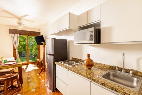 Family Suite with Kitchenette and Walk to Pool | Private kitchen | Cookware/dishes/utensils