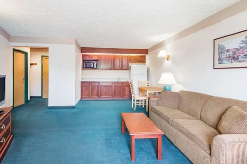 Suite, 1 King Bed | Desk, iron/ironing board, free cribs/infant beds, rollaway beds