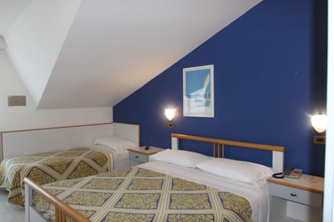 Triple Room, Balcony (Attic) | Minibar, in-room safe, desk, free WiFi