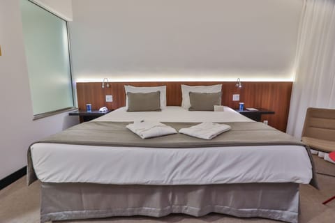 Suíte Business Cama Casal (King size) | 1 bedroom, minibar, in-room safe, desk