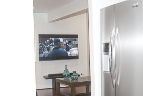 Watch the TV from the kitchen - don't miss any of the action