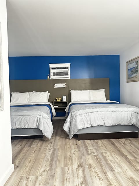 Deluxe Quadruple Room, 2 Queen Beds | Free WiFi, bed sheets