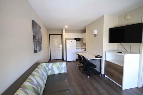 Suite, 2 Double Beds, Non Smoking | Desk, laptop workspace, blackout drapes, iron/ironing board