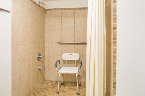 Combined shower/tub, free toiletries, hair dryer, slippers