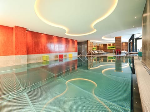 Indoor pool, pool umbrellas, sun loungers