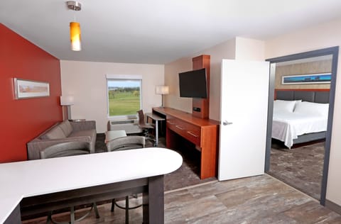 Suite, 1 Bedroom | Desk, blackout drapes, iron/ironing board, free cribs/infant beds