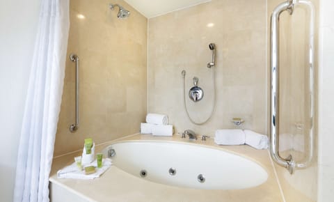 One King Bed, with Jetted Tub | Bathroom | Shower, designer toiletries, hair dryer, towels