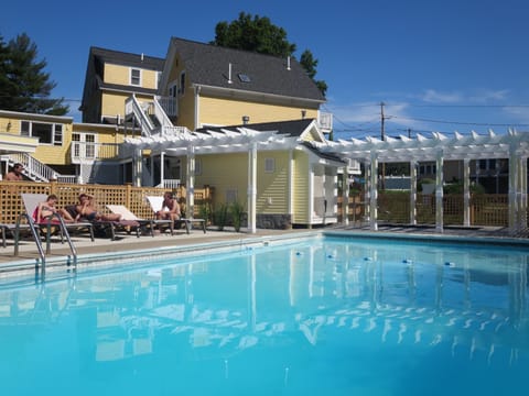 Seasonal outdoor pool, open 9 AM to 9:00 PM, pool umbrellas