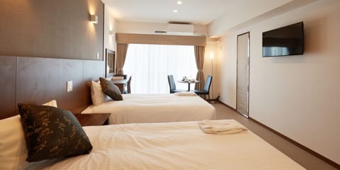 (Condominium Type) Twin Room A | Blackout drapes, free WiFi, bed sheets, wheelchair access