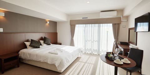 (Condominium Type) Double Room | Blackout drapes, free WiFi, bed sheets, wheelchair access
