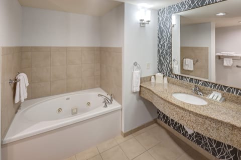 Suite, 1 King Bed | Bathroom | Free toiletries, hair dryer, towels, soap