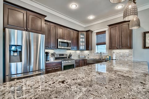 Kitchen is fully stocked and has new stainless appliances