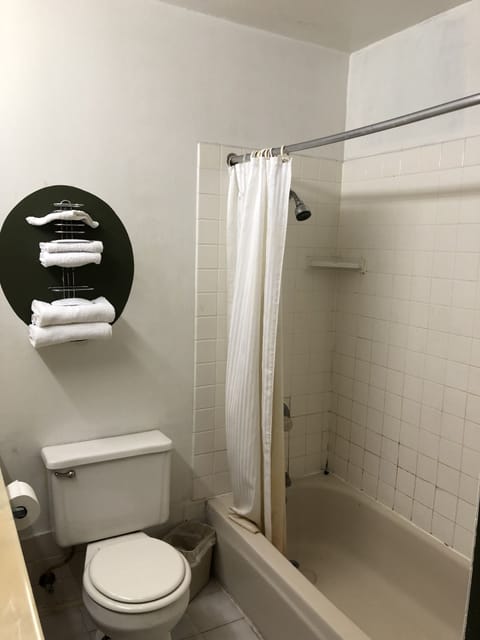 Basic Double Room, 2 Queen Beds | Bathroom | Combined shower/tub, free toiletries, towels