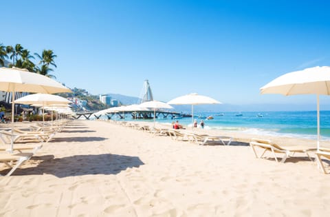 On the beach, sun loungers, beach umbrellas, beach towels