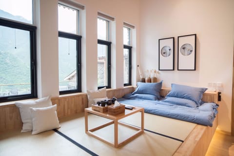 Quadruple Room with Kang Bed (No Courtyard) | Desk, blackout drapes, iron/ironing board, free WiFi