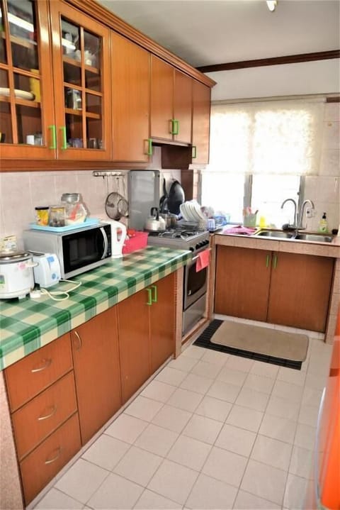 Apartment, 3 Bedrooms | Private kitchen | Full-size fridge, microwave, stovetop, electric kettle