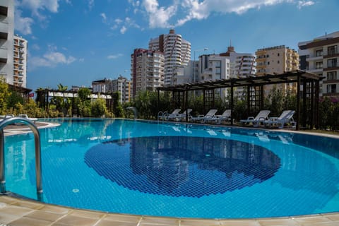 Outdoor pool, open 10:00 AM to 8:00 PM, pool umbrellas, sun loungers