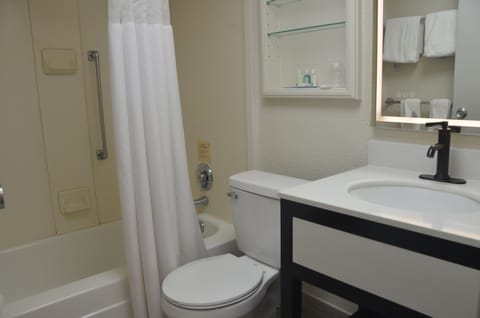 Room, Non Smoking (1 King, 2 Double Beds) | Bathroom | Shower, hair dryer, towels