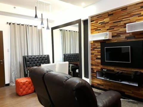 Condo, 2 Bedrooms | Living room | Flat-screen TV