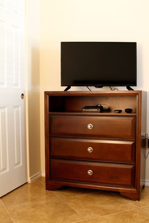 Chest & flat screen tv in the guest bedroom in our vacation rental. Sun City TX