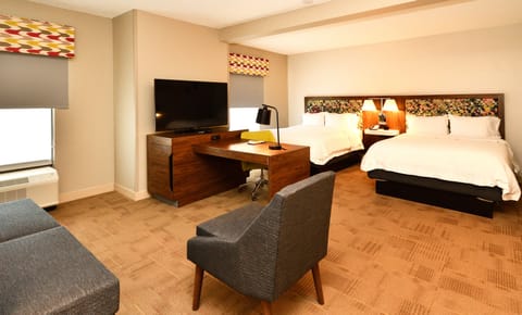 Suite, 2 Queen Beds, Non Smoking | Living area | 55-inch flat-screen TV with satellite channels, TV