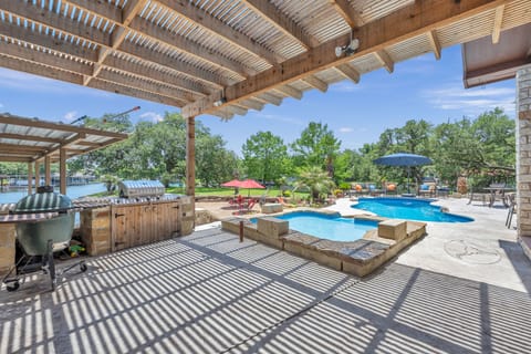 Grill area with standard grill and a green egg grill.