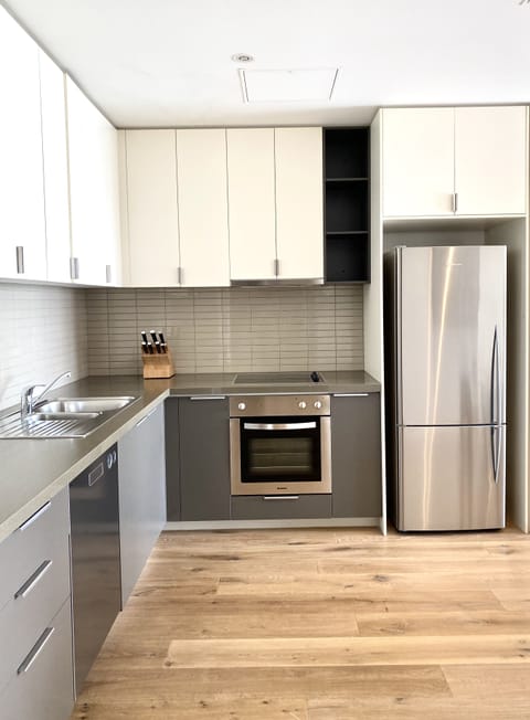 Premium One Bedroom Apartment | Private kitchen | Fridge, microwave, stovetop, dishwasher