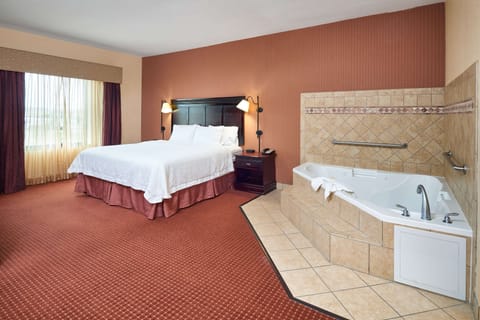Suite, 1 King Bed, Non Smoking | Bathroom | Shower, hair dryer, towels