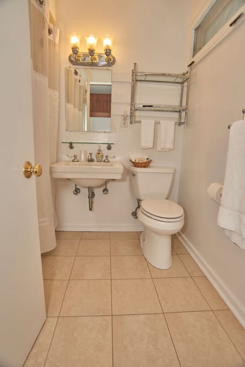 Room, Multiple Beds, Private Bathroom | Bathroom | Combined shower/tub, free toiletries, hair dryer, towels