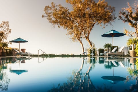 Outdoor pool, pool umbrellas, sun loungers