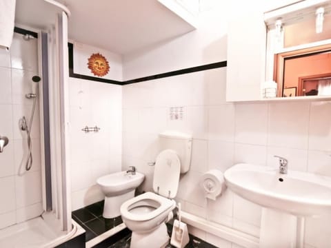 Shower, hair dryer, slippers, towels