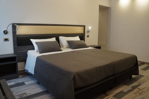 Family Triple Room | Free minibar, in-room safe, desk, soundproofing