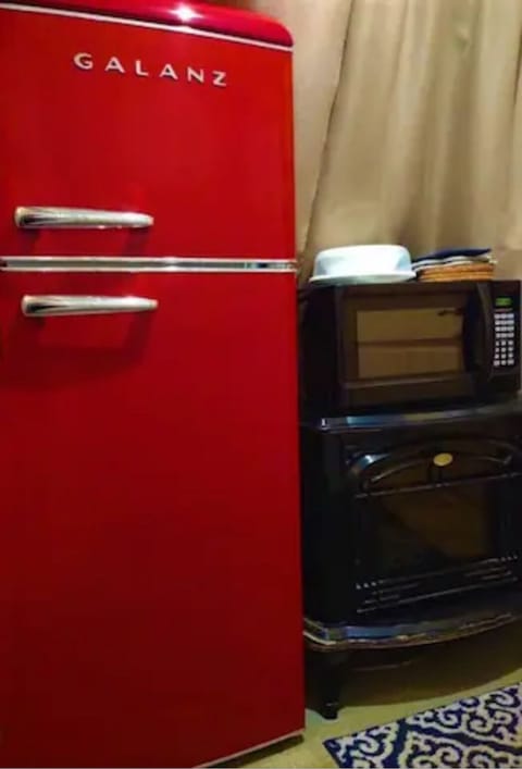 A cool red retro-look 7.5 cu ft fridge/ freezer is on board for your food items.