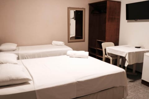 Standard Triple Room, Multiple Beds | Minibar, desk, free WiFi, bed sheets