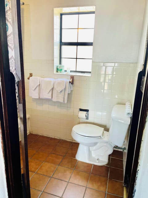 Family Room, 2 Queen Beds, Non Smoking | Bathroom | Combined shower/tub, free toiletries, towels