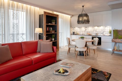 Two-Bedroom Apartment | Living area | 55-inch flat-screen TV with satellite channels, TV, tablet