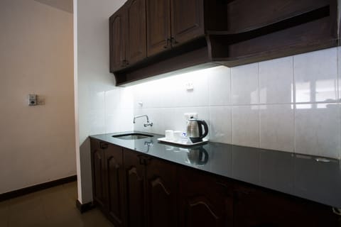 Economy Suite, 1 Double Bed | Private kitchen | Fridge, coffee/tea maker, electric kettle