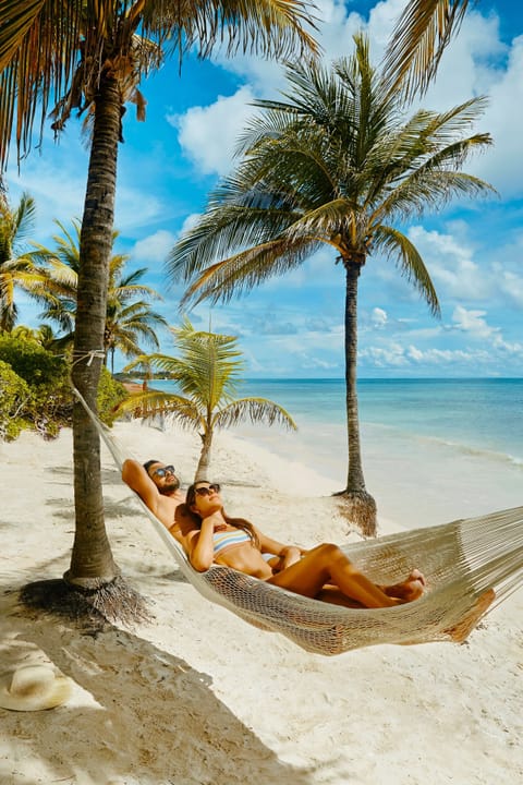 Private beach, white sand, sun loungers, beach umbrellas