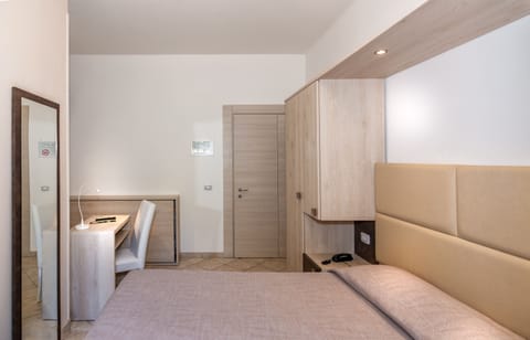 Economy Double Room, Ground Floor | Minibar, in-room safe, desk, laptop workspace