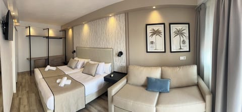 Comfort Quadruple Room with Free Airport Shuttle | Minibar, in-room safe, individually decorated, individually furnished