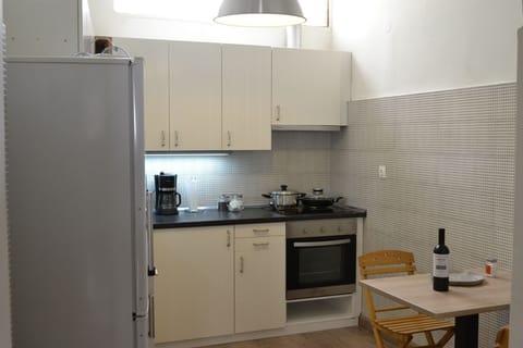 Apartment, 2 Bedrooms | Private kitchen | Fridge, coffee/tea maker, cleaning supplies, freezer