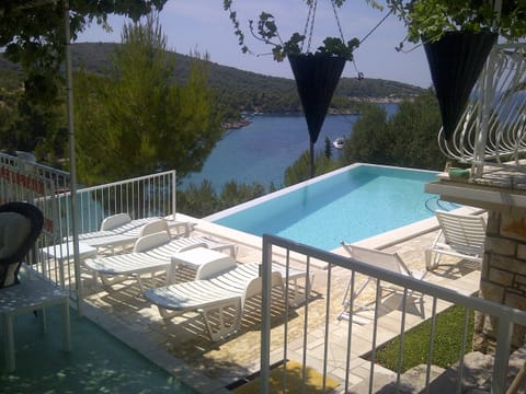 Outdoor pool, an infinity pool, open 8:00 AM to 9:00 PM, free cabanas