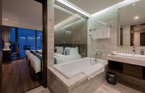 Suite Triple Balcony Room | Bathroom | Separate tub and shower, rainfall showerhead, designer toiletries