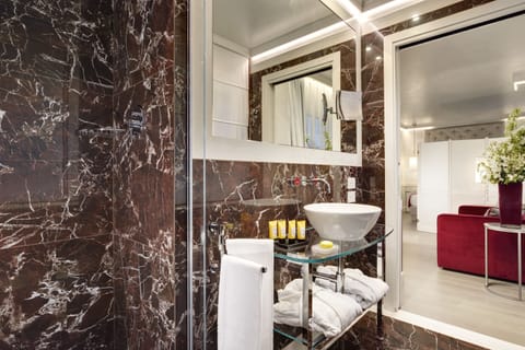 Superior Room | Bathroom | Rainfall showerhead, designer toiletries, hair dryer, bathrobes