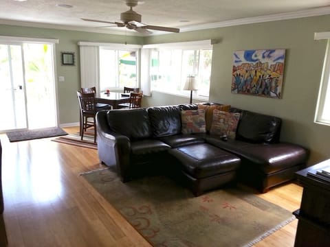Living room with Deck w BBQ and patio furniture is off the sliding glass door. 