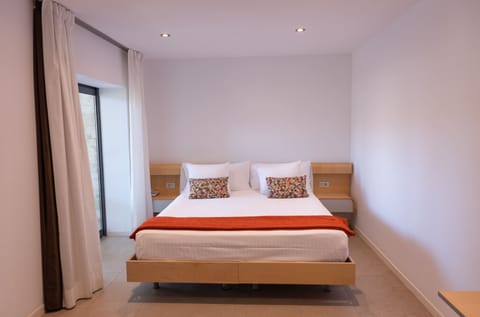 Superior Double Room, Balcony | Minibar, in-room safe, desk, laptop workspace