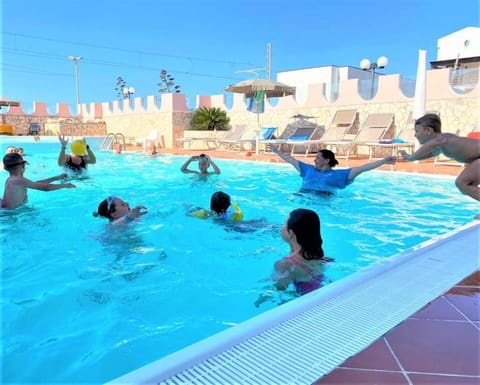 Seasonal outdoor pool, pool umbrellas, sun loungers